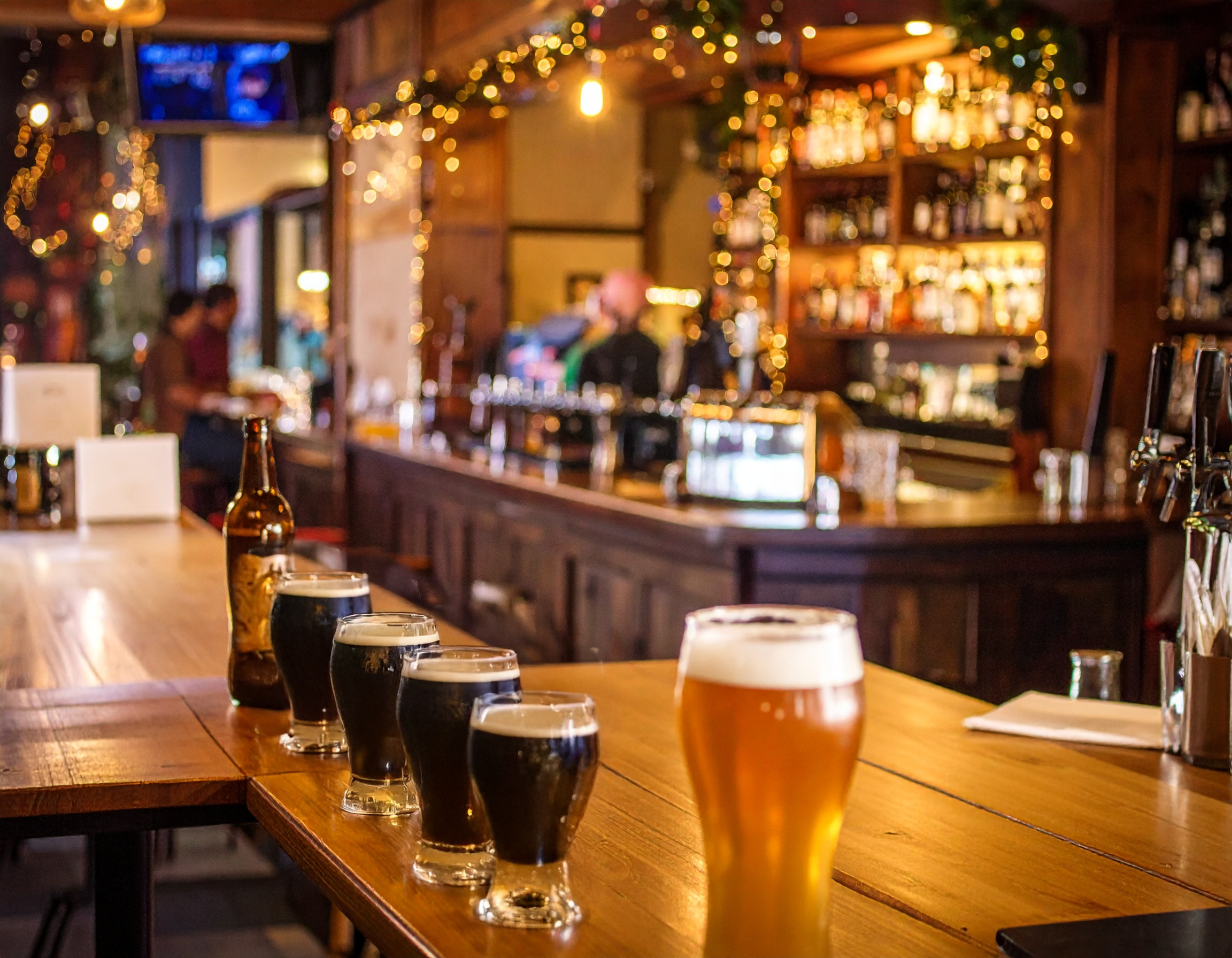 Das Murphy's Law in Regensburg - das Bild zeigt einen Tresen mit vier Guinness und einem Weißbier